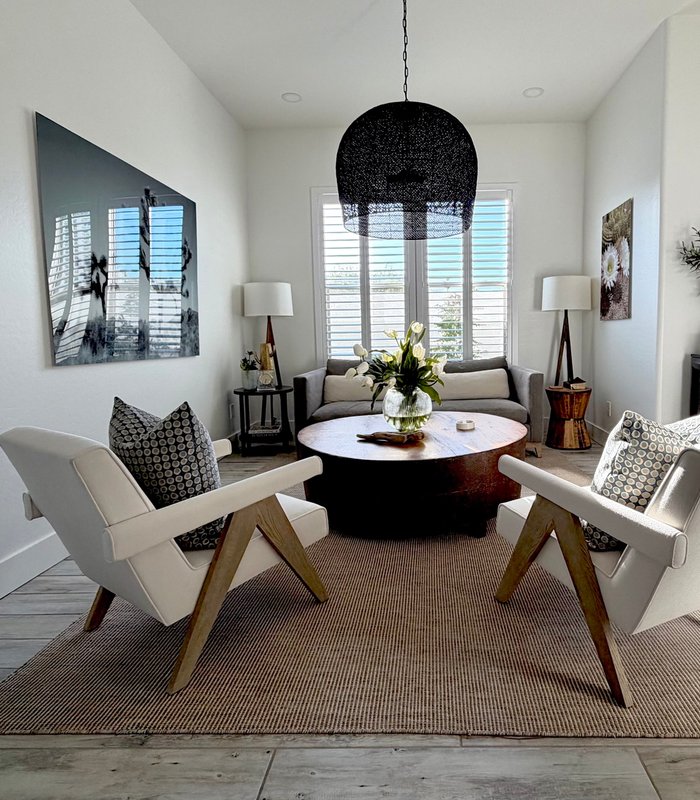 Great room with Norman Woodlore plantation shutters framing a desert view, Phoenix metro install
